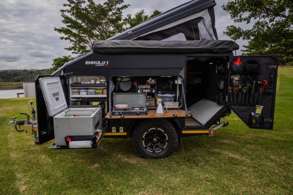 Side profile of the Infanta Enkulu 1 for sale with door open and kitchen area