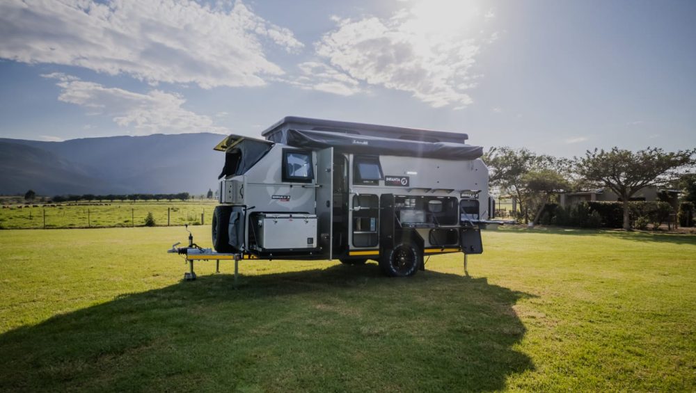 Zoomed out photo of the Infanta 4x4 Enkulu 3 Caravan for sale against beautiful sky