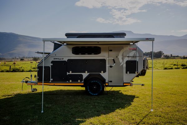 A clear image of the Infanta Enkulu 2 for sale in South Africa shot agains beautiful mountains